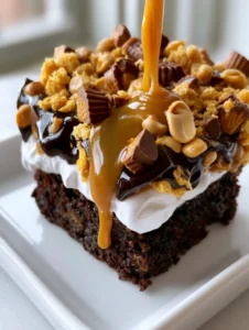 Close-up handheld photo of a Chocolate Peanut Butter Dump Cake slice showing the viscous peanut butter drizzle dripping down the side.