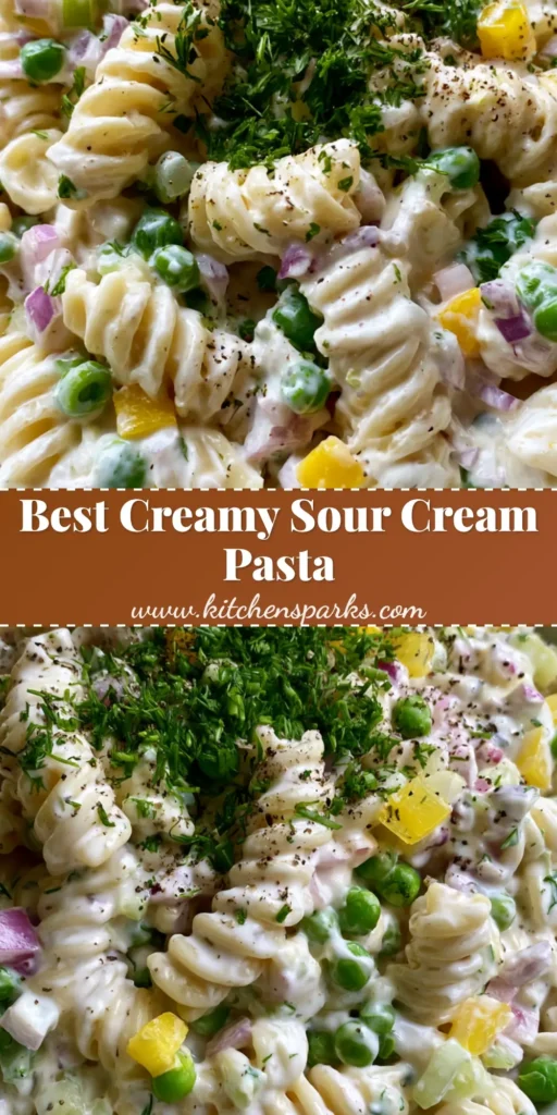 Sour Cream Pasta Salad with Fresh Dill and Crisp Vegetables 4 A towering white ceramic bowl filled with glossy Sour Cream Pasta Salad, garnished with fresh green dill and coarse black pepper.
