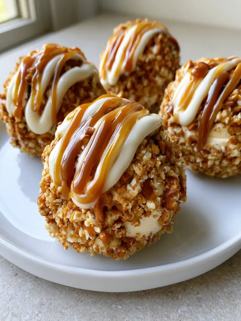 Close-up of Salted Caramel Pretzel Cheesecake Bites showing the dense pretzel coating and rich caramel drizzle.
