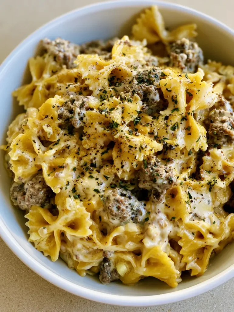 Overhead view of Creamy Beef Bowtie Pasta featuring al dente bowtie pasta and savory ground beef.