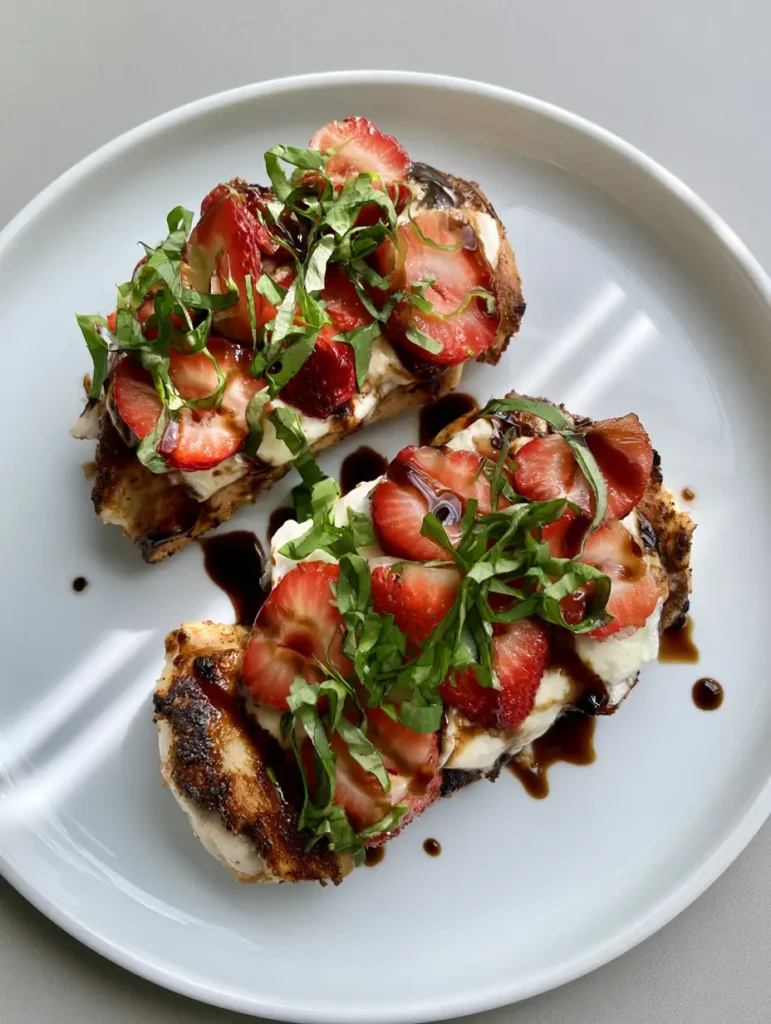 Strawberry Basil Chicken featuring glossy balsamic glaze and bright green basil chiffonade.