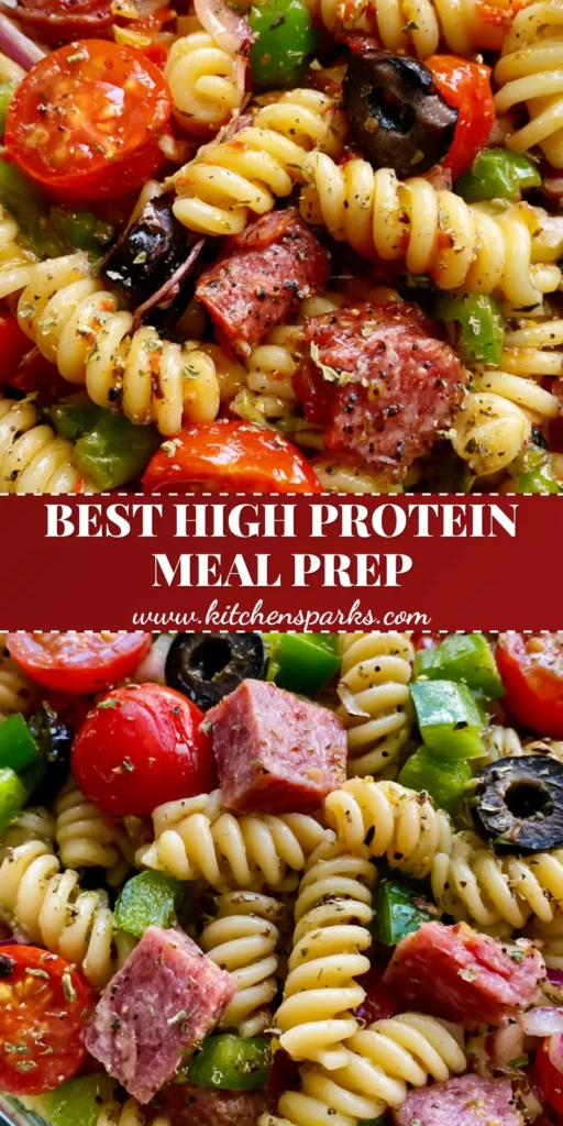 A close-up shot of High Protein Pasta Salad with rotini, salami, and vegetables in a glass meal prep container.