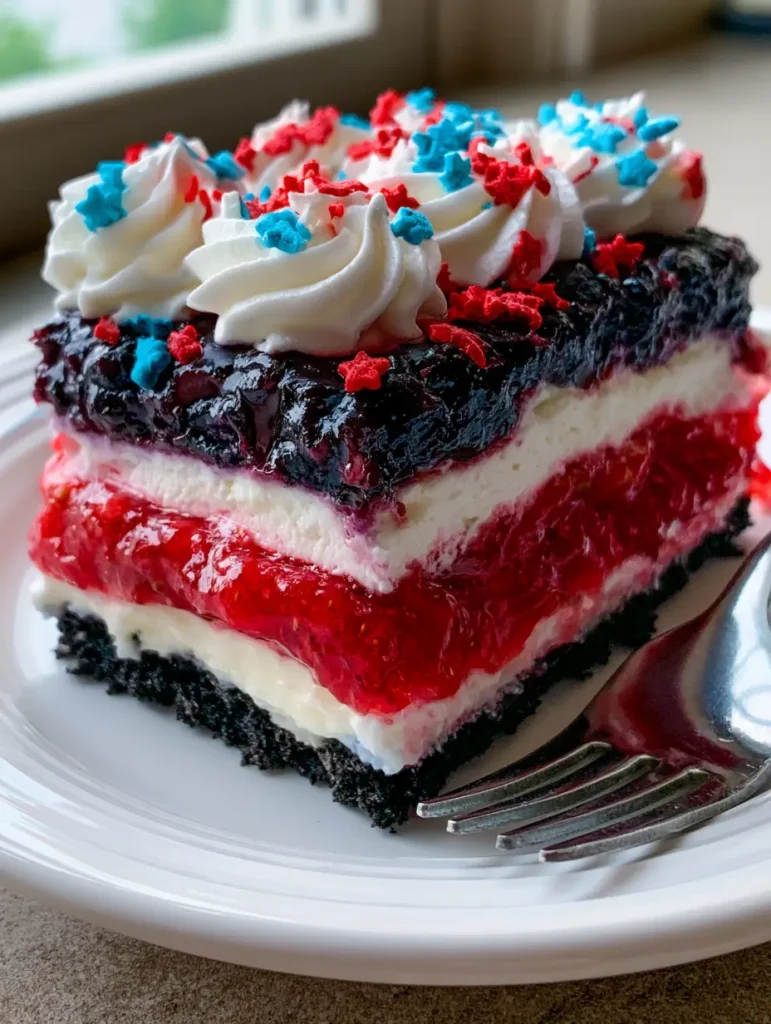 4th of July Dessert Lasagna: The Ultimate Patriotic No-Bake Treat 1 Close up of the blueberry fruit filling and whipped topping on a 4th of July dessert lasagna.